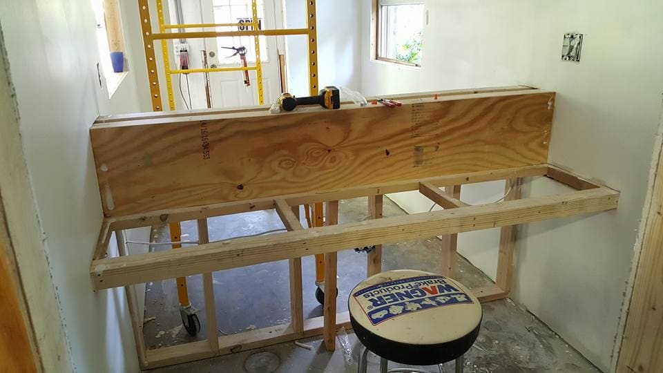 Bathroom opened to the studs with new framing for the tub deck