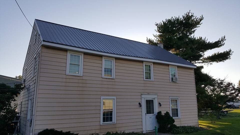 Farmhouse with a new charcoal metal roof