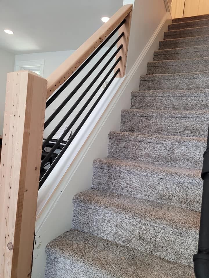 Rebuilt staircase railing with metal balusters