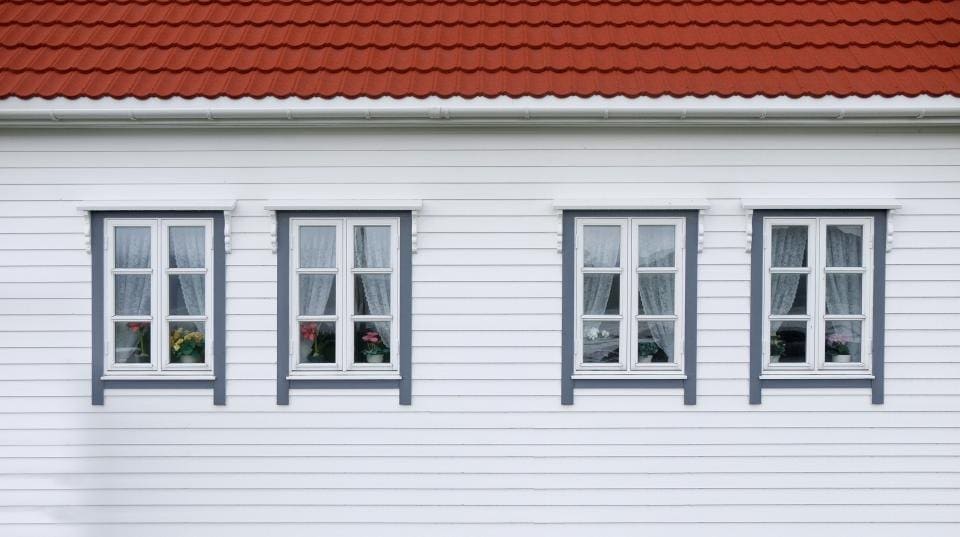 White sided house with many windows