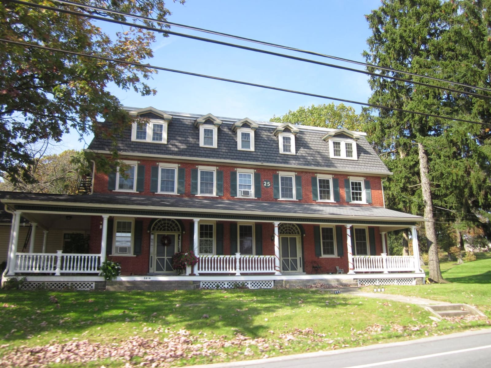 A brick building with a long front porch in Elizabethtown, Pennsylvania
