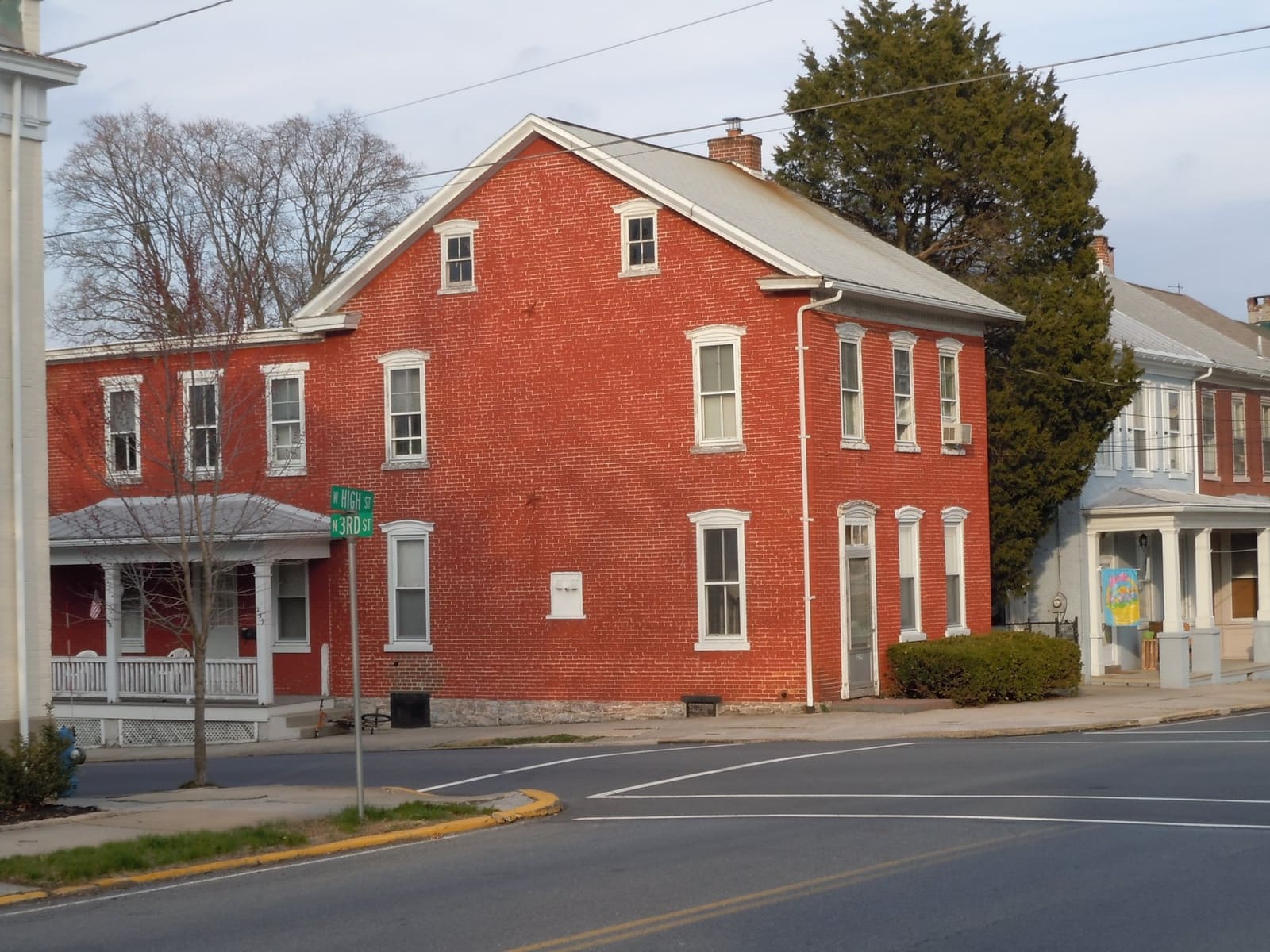 A red brick home with a porch in Womelsdorf, Pennsylvania